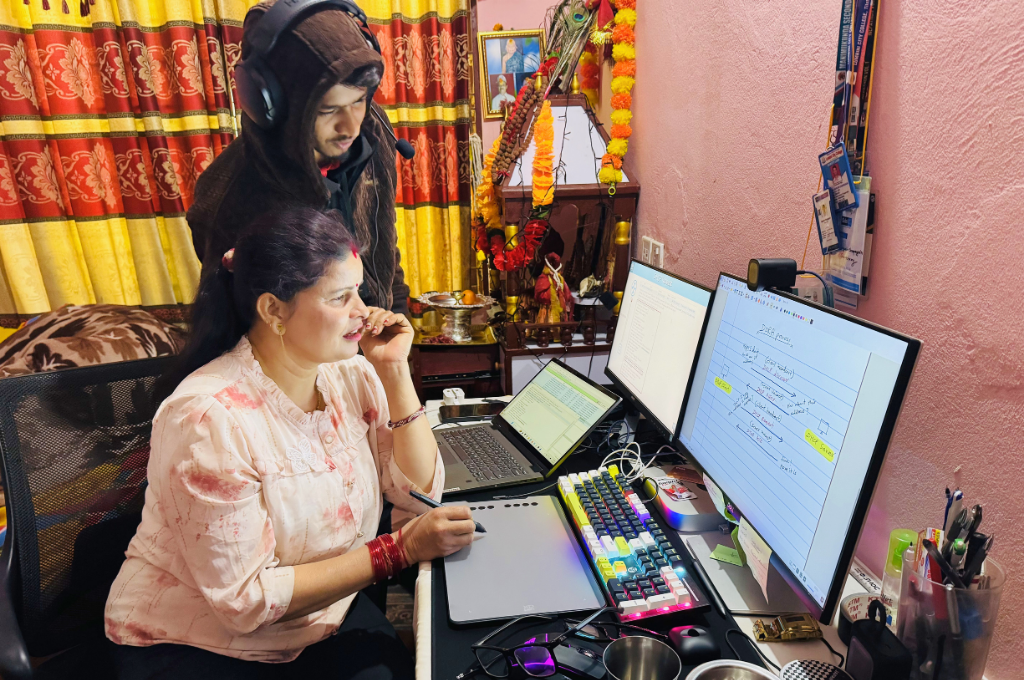 Aayush Chapagain teaching his mother basic computer skills at home